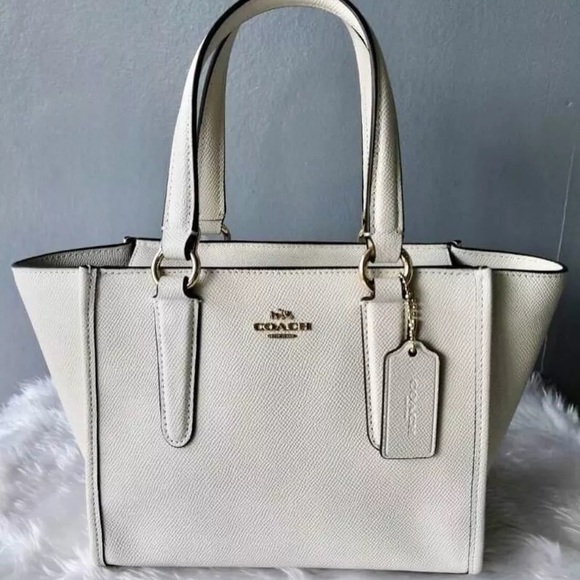 Coach Handbags - HP🌸Authentic COACH sm white leather carryall bag.